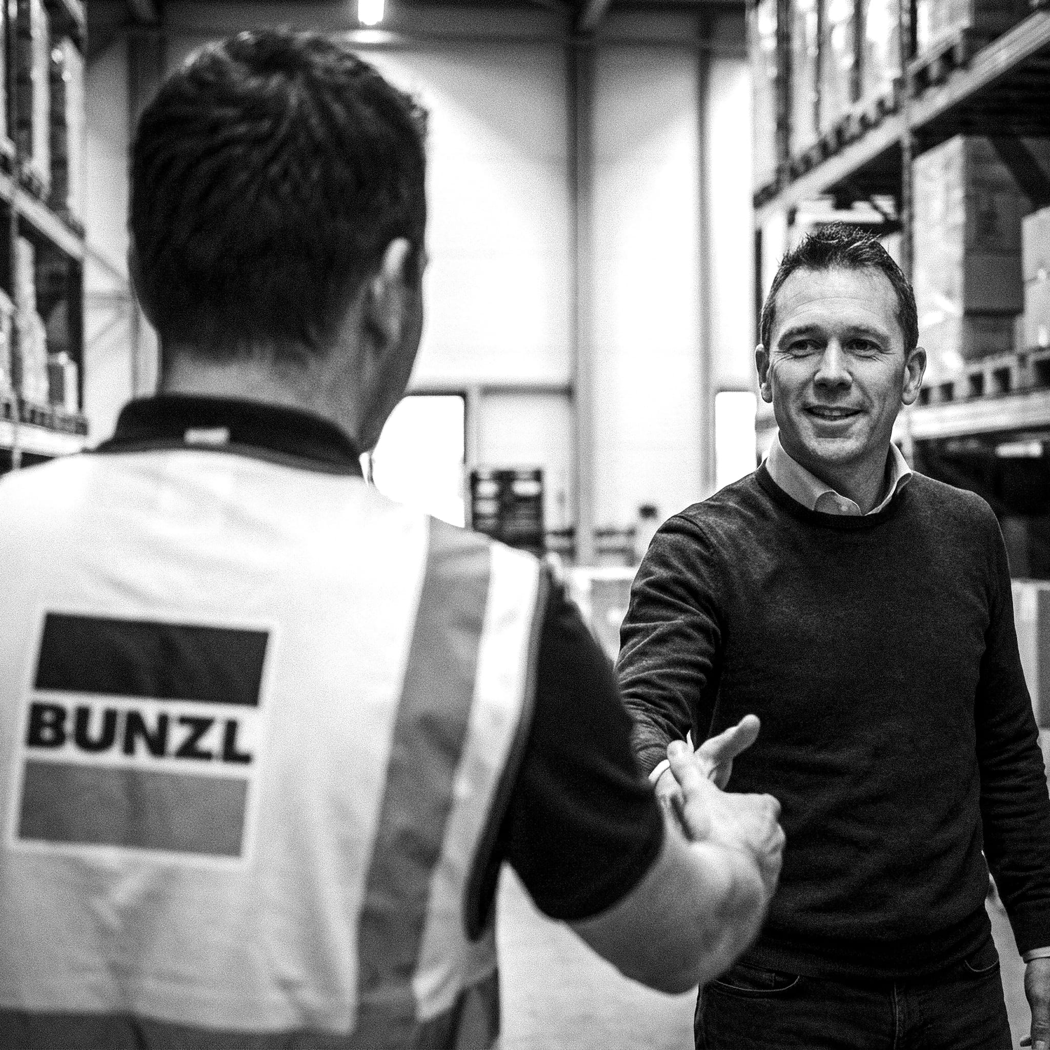 Firefly_Create a black-and-white photographic scene inside a modern warehouse.__The image is  452876