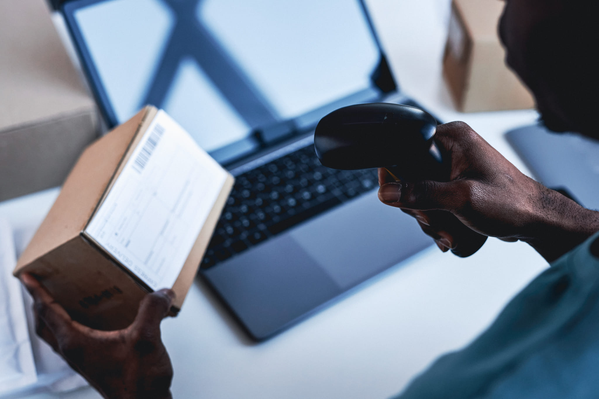 hand-of-young-male-worker-of-post-office-scanning-2025-03-08-19-31-56-utc