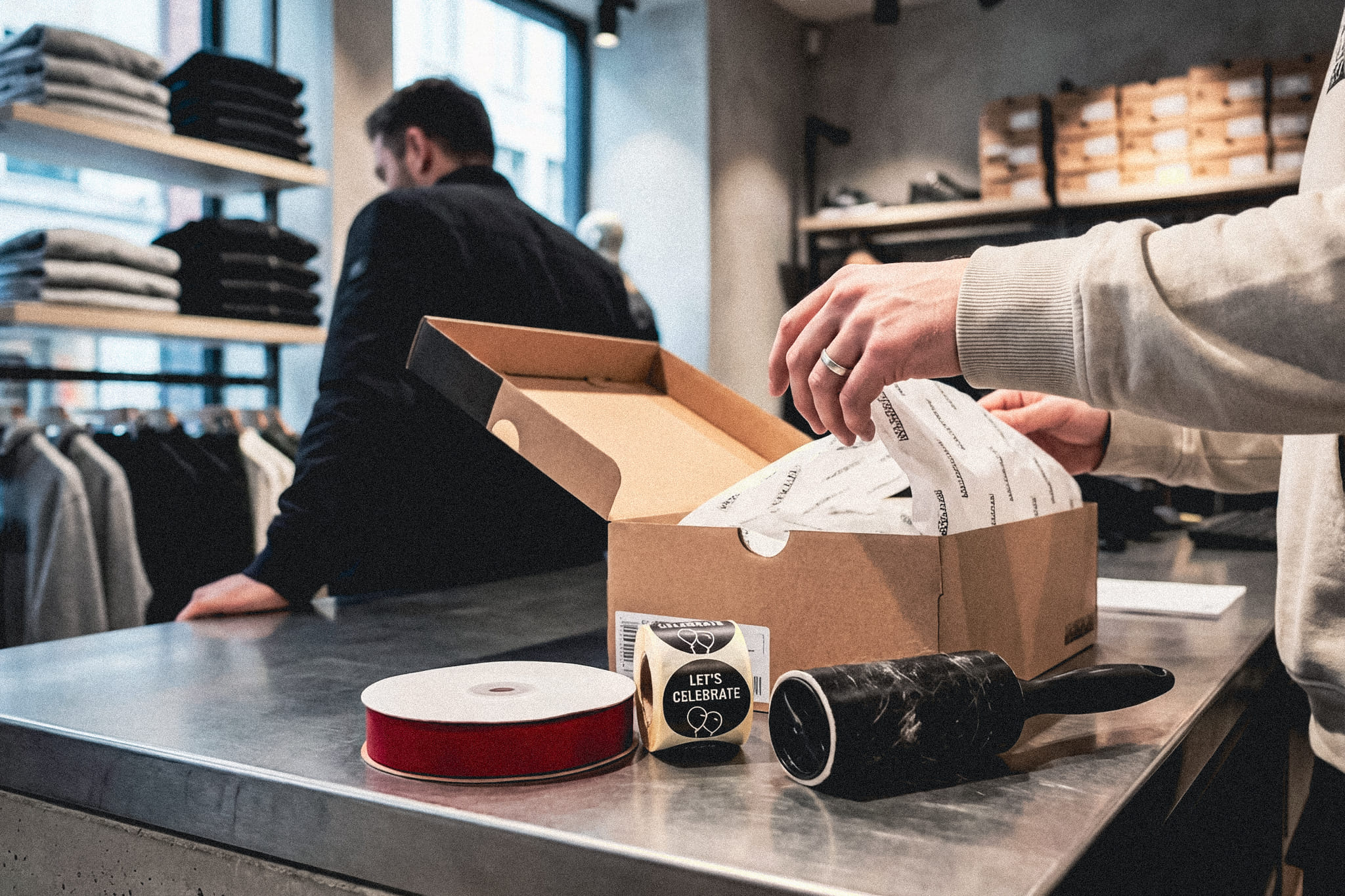 Firefly_Full-colour editorial photo behind the counter of a modern flagship fashion store. Fo 797308-2